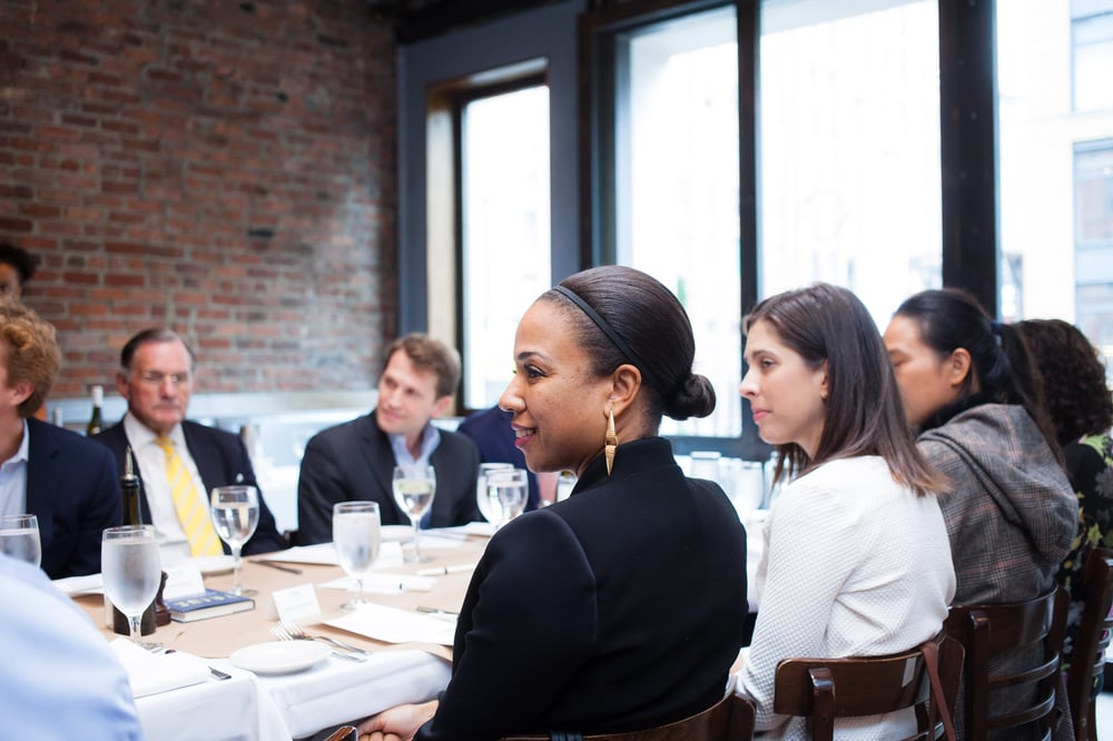Executives smiling around a table Executives smiling around a table